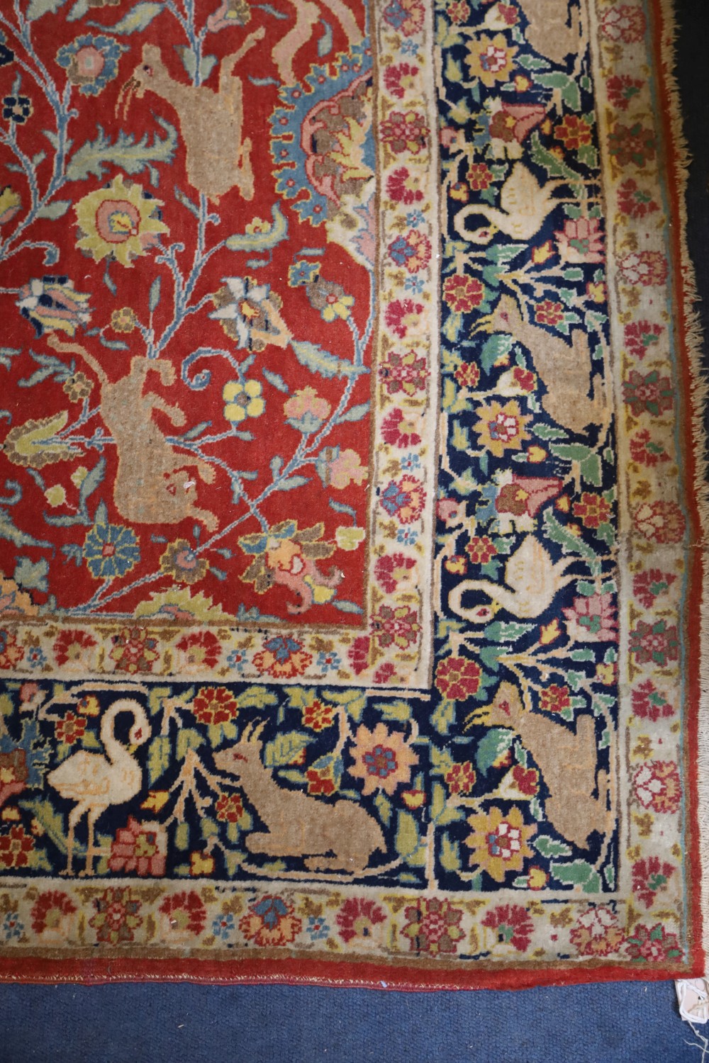 A Caucasian red ground rug, 6ft by 4ft 7in.